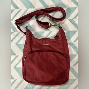 Travelon Red Crossbody Bag with Adjustable Strap and Minimalist Design